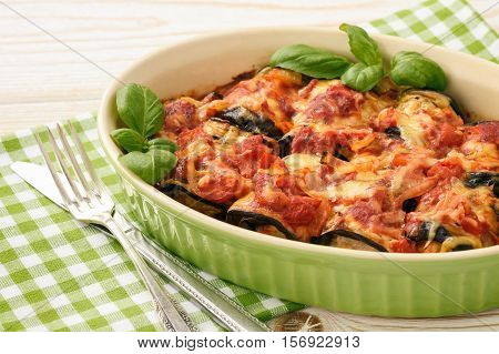 Casserole with roasted eggplants stuffed with minced meat.