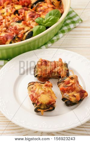 Roasted eggplants stuffed with minced meat and baked with tomatoes and cheese.