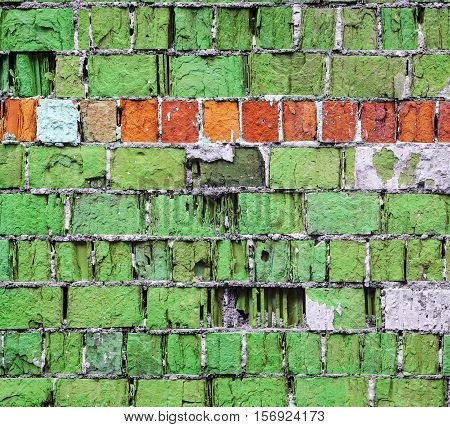 Green brick wall texture with horizontal stripe. Pop-art brick wall with old plaster elements