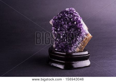 Amethyst geode on black background. Beautiful natural crystals gemstone.
