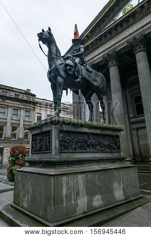 Statue Of Duke Of Wellington, Riding A Horse, Wearing A Traffic Cone On His Head. In Front Of Galler