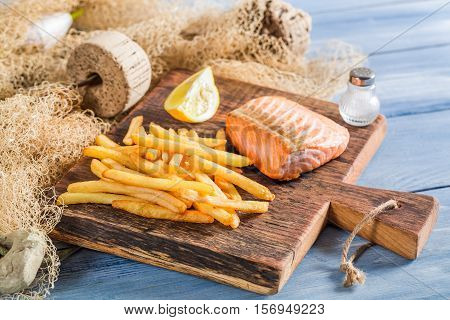Fresh French Fries With Salmon Served On Plate