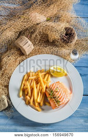 Delicious French Fries With Salmon With Lemon