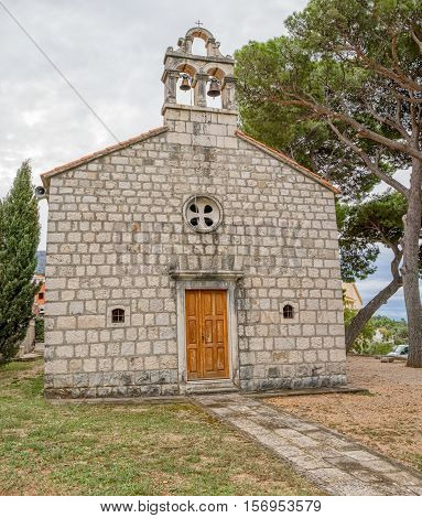 Virgin Mary church on graveyard in Tucepi, Croatia.