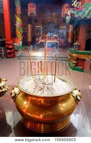 Incense Sticks In The Pot Inside Chinese Temple