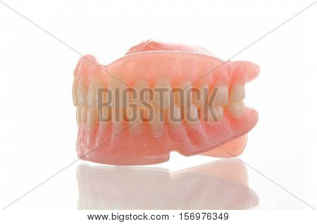 Photo of dental prosthesis on white background