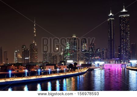 Dubai Skyline at night from new Dubai Canal, U.A.E