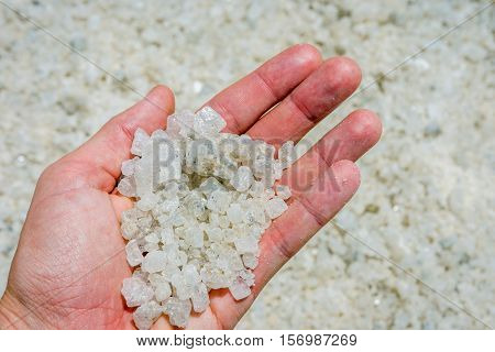 Holding Salt Crystals In Hand