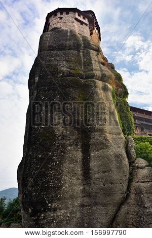View from bottom on the Monastery Roussanov at sunrise Meteora Greece
