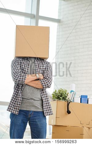 Man standing with cardboard boxx on his head