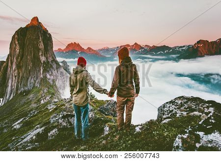Couple Adventurers Hands Holding  Traveling In Norway Mountains Healthy Lifestyle Concept Active Vac