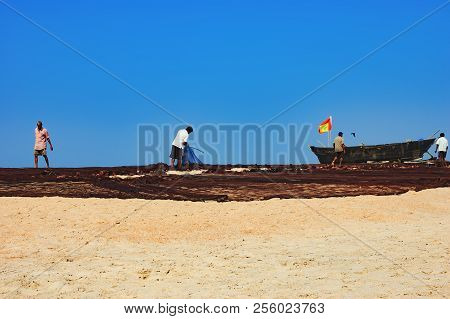 Fishermen Dried His Old Fisher's Net In Goa, India