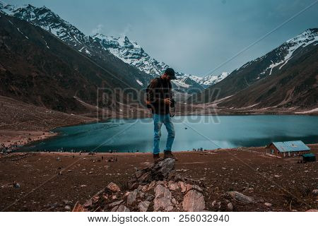 Traveller Stand On A Rock At Lake Saif Al Maluk In Naran Valley, Pakistan
