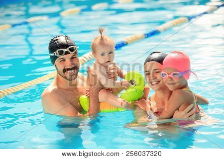 Happy Family Having Fun By The Swimming Pool. Pool, Leisure, Swimming, Summer, Recreation, Healthy L