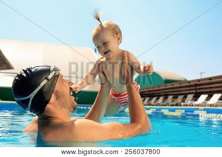 Happy Family Having Fun By The Swimming Pool. Pool, Leisure, Swimming, Summer, Recreation, Healthy L