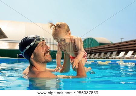 Happy Family Having Fun By The Swimming Pool. Pool, Leisure, Swimming, Summer, Recreation, Healthy L