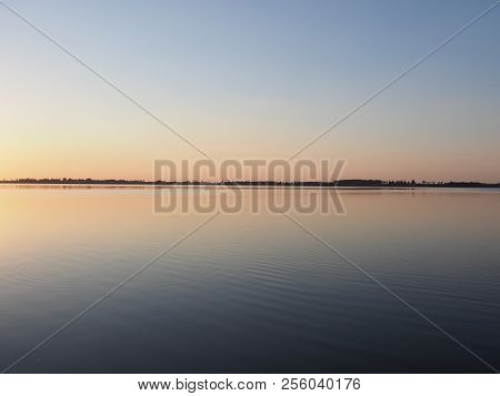 Symmetrical Panorama Of Sun Set Over Artificial European Goczalkowice Reservoir And Coastline Near P