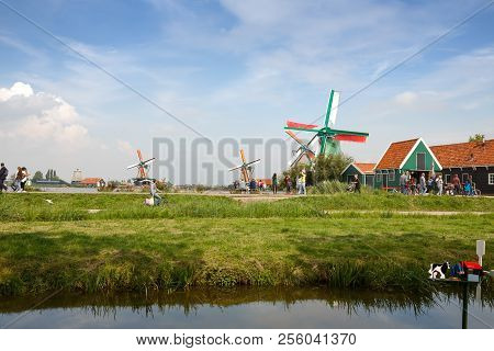 Zaanse Schans, Netherlands, August 19, 2015 - Traditional, Authentic Dutch Windmills At The River Za