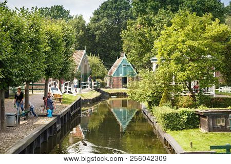 Enkhuizen, Netherlands - August 19, 2015 - The Houses And People In The Traditional Fisherman Villag