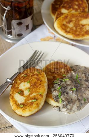 Potato Cutlets Or Pancakes With Mushroom Sauce And Green Onions. Rustic Style.