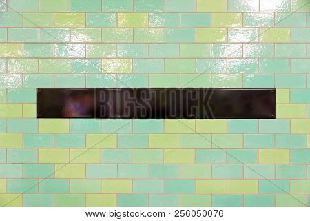 Black Rectangular Panel With Copyspace On A Tiled Wall