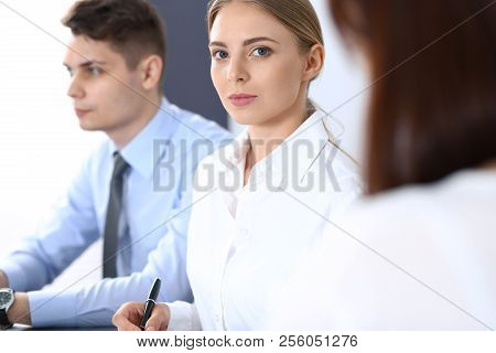 Group Of Business People Or Lawyers Discussing  Terms Of Transaction In Office. Meeting And Teamwork