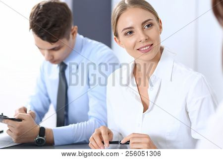 Group Of Business People Or Lawyers Discussing  Terms Of Transaction In Office. Meeting And Teamwork