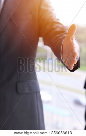 Unknown Business Man Offering Handshake While Standing Straight. Success Cooperation And Agreement C