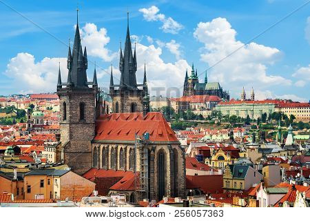 Tynsky And St Vita Cathedrals Among The Red Roofs Of Prague. View From Above