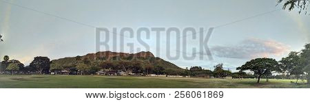 Kapiolani Park At During Day With Diamond Head And Clouds In The Distance On Oahu, Hawaii.