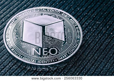 Neo Cryptocurrency Coin On Grey Shiny Background.