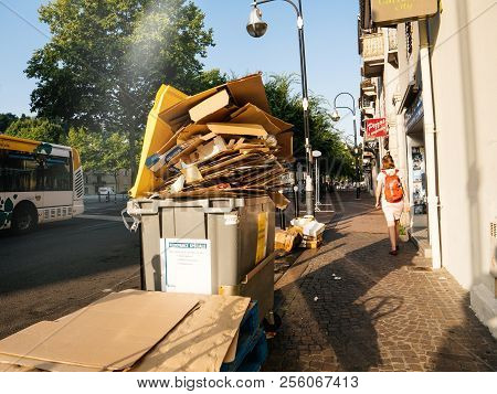 Chambery, France - Aug16, 2018: French Street In Chambery With Dumpsters Being Full With Paper Cardb
