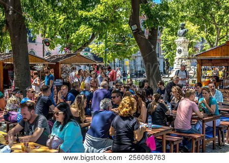 Tourists And Locals Enjoying The Summer Of Lisbon In The Bairro Alto In Lisbon, Portugal