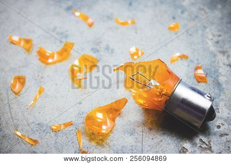 Damaged Light Bulb And Glass Shards