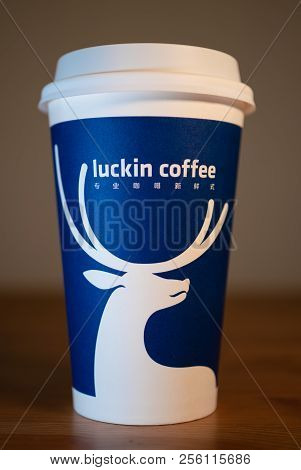 1 Septembre 2018, Wuhan China : A Coffee Cup Of Luckin Coffee On Wooden Table Background