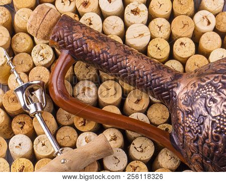 The Clay Bottle, Metal Corkscrew And Cork