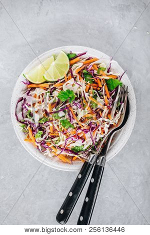 Cilantro Lime Coleslaw Salad With Red And White Cabbage On Stone Background