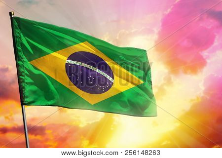 Fluttering Brazil Flag On Beautiful Colorful Sunset Or Sunrise Background. Brazil Success And Happin