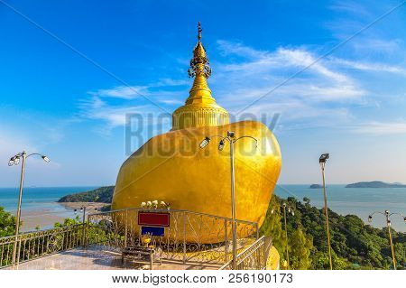 Replica Of Phra That In Kwaen (golden Rock) In Wat Koh Sirey Temple In Phuket In Thailand In A Summe