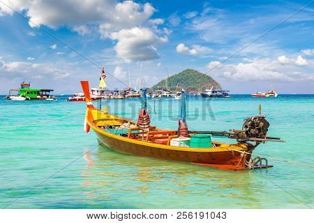 Traditional Long Tail Boat On Coral (ko He) Island Near Phuket Island, Thailand In A Summer Day