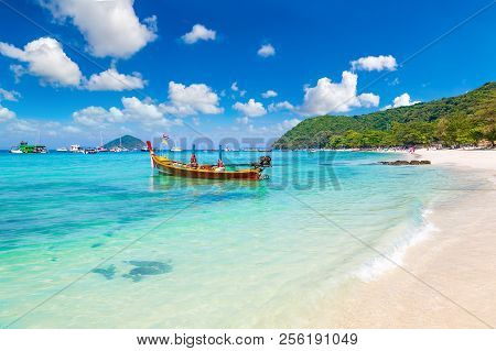 Traditional Long Tail Boat On Coral (ko He) Island Near Phuket Island, Thailand In A Summer Day