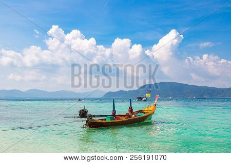 Traditional Long Tail Boat On Coral (ko He) Island Near Phuket Island, Thailand In A Summer Day