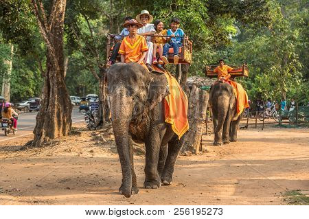 Angkor Wat, Cambodia - March 15, 2018: Tourists Ride An Elephant At The Area Of Angkor Wat, Near Sie