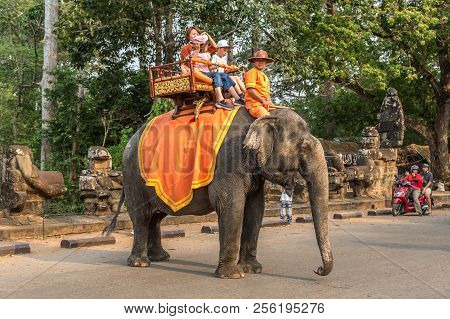 Angkor Wat, Cambodia - March 15, 2018: Tourists Ride An Elephant At The Area Of Angkor Wat, Near Sie