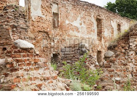 Cloudy Weather And The Ruins Of An Old Fortress Of Red Brick, Decayed And Destroyed As A Result Of B
