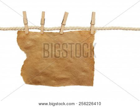 Cotton Rope And Four Pins With Piece Of Craft Paper Isolated On White Background