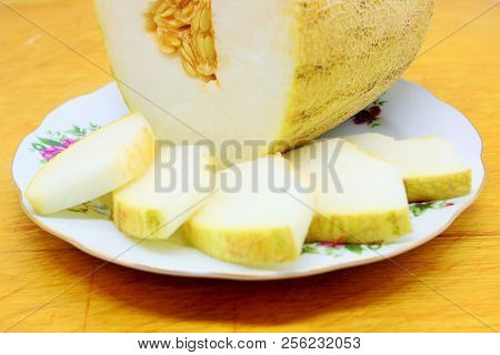 Melon - White And Juicy. Very Fragrant Slices Of Melon On A Plate.