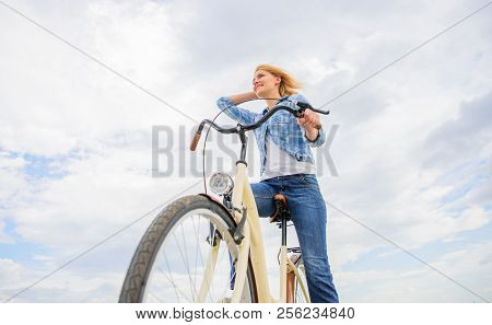 Girl Rides Bike Sky Background. Bike Rental Shops Primarily Serve People Who Do Not Have Access To V