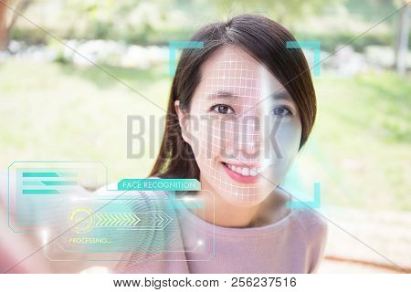 Young Woman Is Taking Selfie For Facial Recognition Concept
