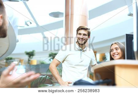 Group Of Young Modern People In Smart Casual Wear Having A Brainstorm Meeting While Standing In The 